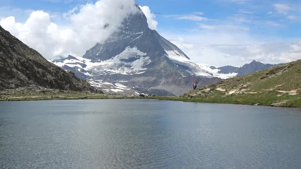 Scenic view on snowy Matterhorn peak and lake Stellisee, Zermatt