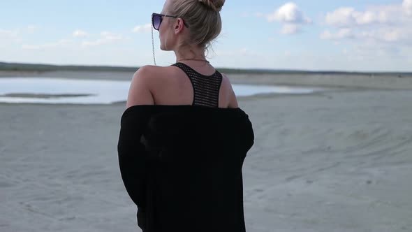 Seductive Woman Making Undulating Smooth Movements with Hands Revealing Body alt