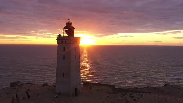 Drone Flight Over Rubjerg Knude Lighthouse At Sunset alt