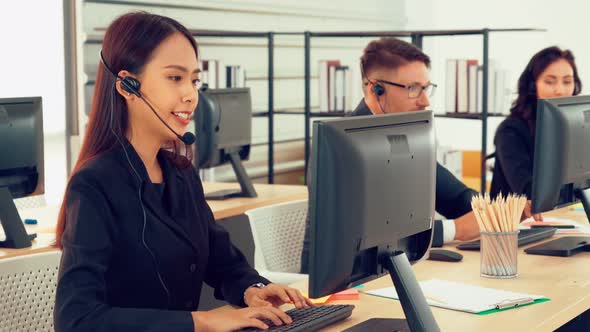 Business People Wearing Headset Working in Office alt