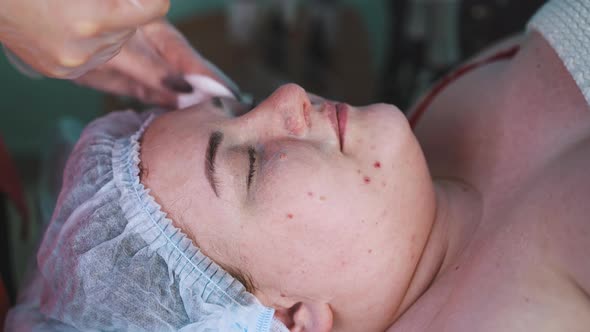 Beautician Removes Foamy Mask From Woman Face After Massage alt