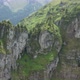 Flying towards a beautiful green mountain top in Switzerland - VideoHive Item for Sale