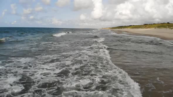 AERIAL: Flying Very Low Above the Blue Sea Waves, Slow Motion, High Speed Camera, 60 FPS alt