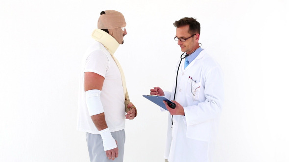 Doctor Talking To Very Injured Patient