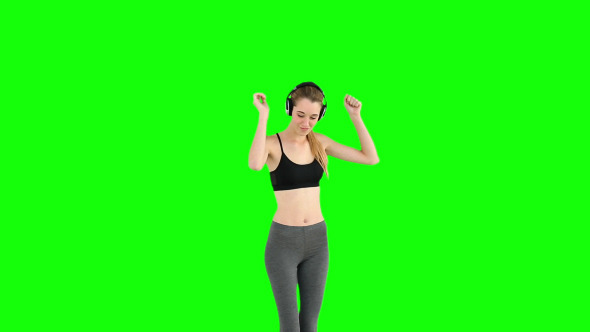 Fit Model Listening To Music And Dancing 1