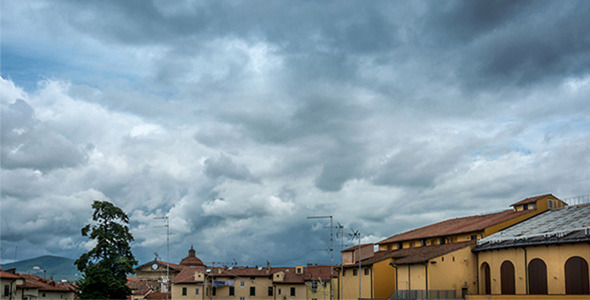 Time Lapse of Sky with Clouds over City Roofs