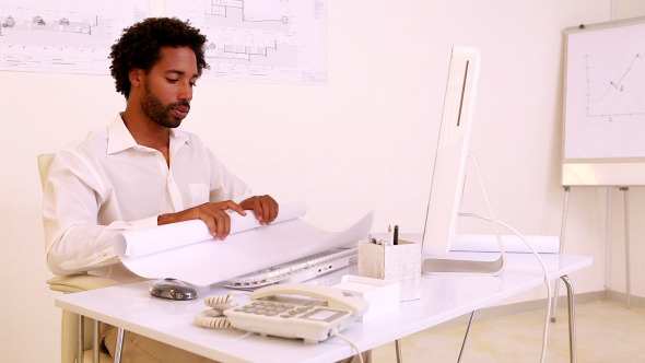 Architect Working At His Desk