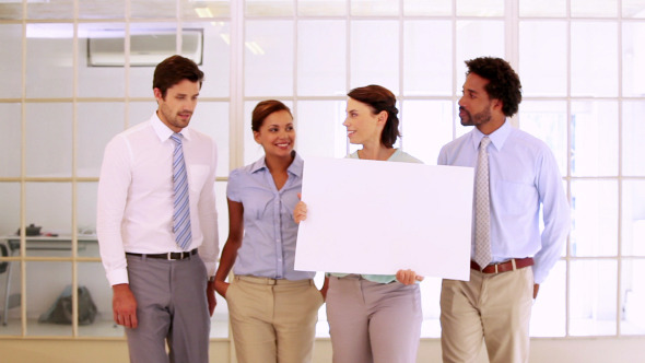 Business Team Showing A White Card