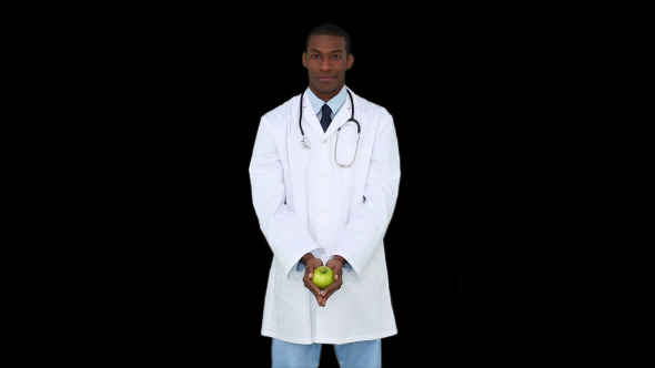 Happy Young Doctor Showing Camera An Apple 1