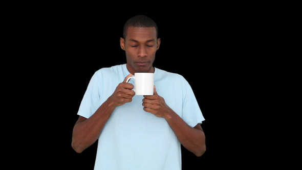 Casual Young Man Enjoying Cup Of Coffee 1
