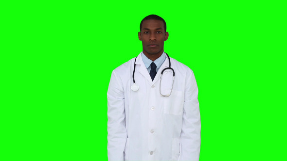 Serious Young Doctor Showing Tablets To Camera 2
