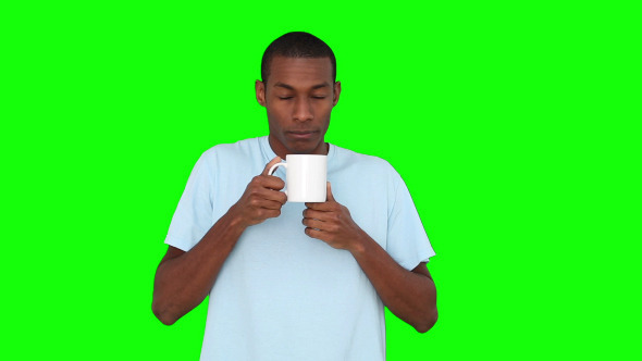 Casual Young Man Enjoying Cup Of Coffee 2