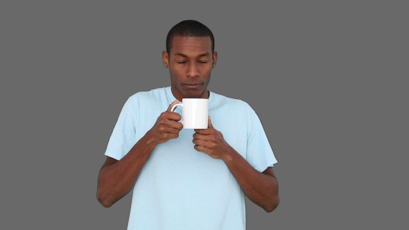 Casual Young Man Enjoying Cup Of Coffee 3