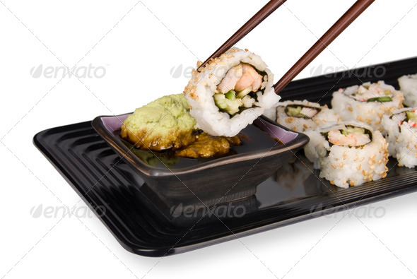 Sushi roll and chopsticks - Stock Photo - Images