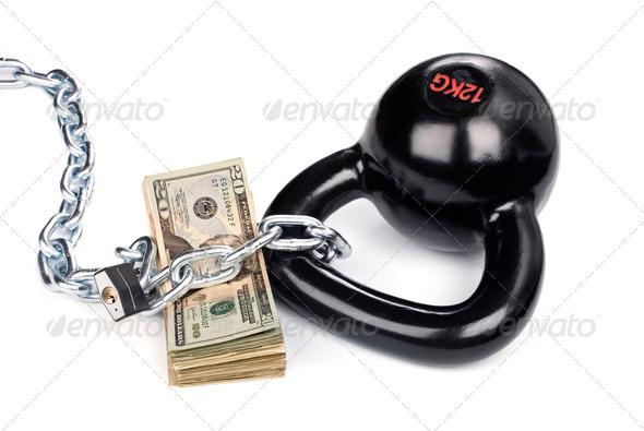 Cash secured by ball and chain - Stock Photo - Images