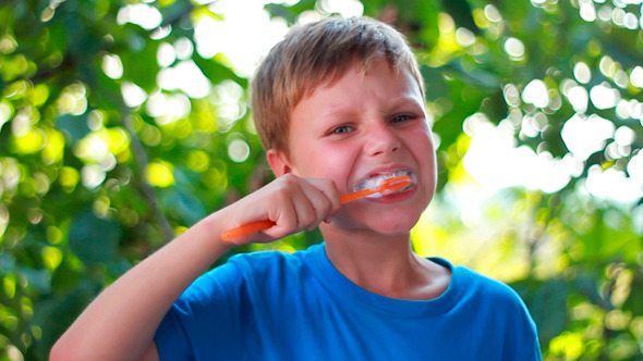 Boy Is Brushing His Teeth