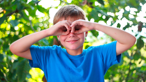 Boy Making Binoculars With His Hands