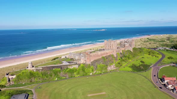 Aerial footage the famous Bamburgh Castle, a castle on the northeast coast of England