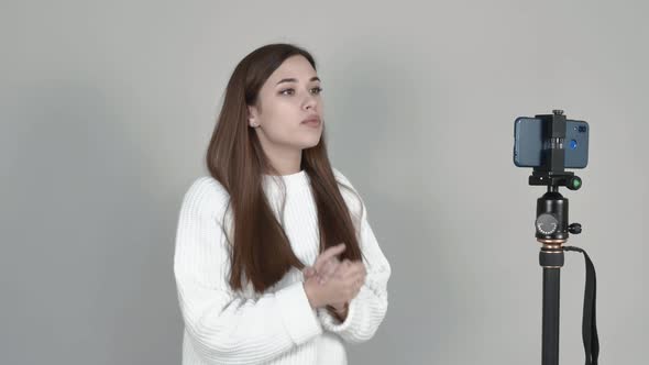 Caucasian Girl Blogger Communicates in Front of Camera with Subscribers Figures alt