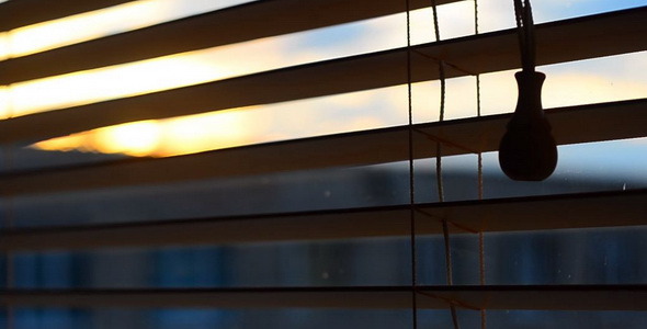 Sunset Outside the Wood Window Blinds 