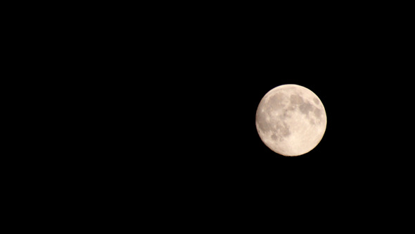 Full Moon Moving Across Night Sky