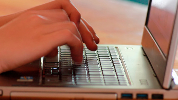 Male Hands Typing On Notebook Keyboard 1