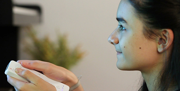 Girl Playing Video Game Having Fun  alt