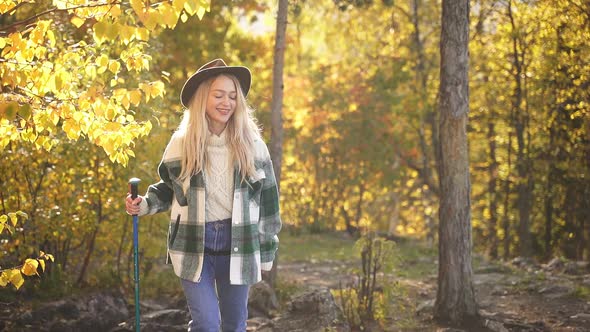 Happy Caucasian Blonde Woman is Enjoying Time in the Forest