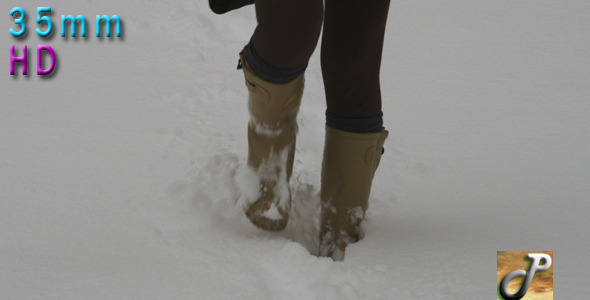 Woman Walking Outdoor In Snow alt