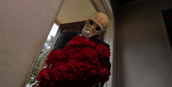 Gas Mask Man Brings Flowers
