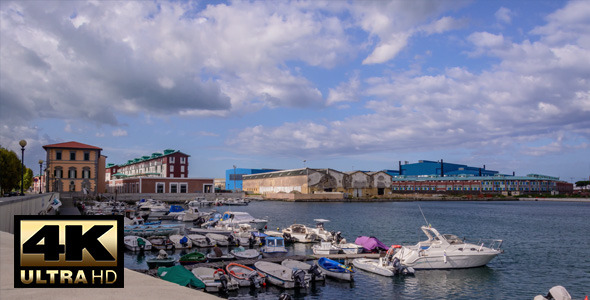 Cloudy Sky with Boats at Port
