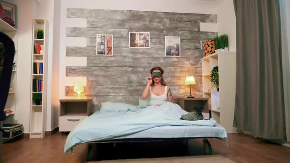 Zoom in Shot of Young Woman in Pajamas alt