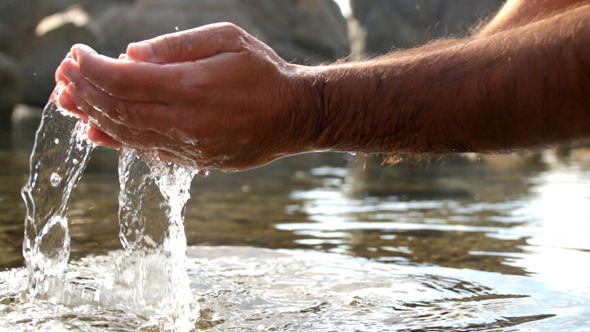 Collecting Water with Hands at the Seashore by creativesight | VideoHive