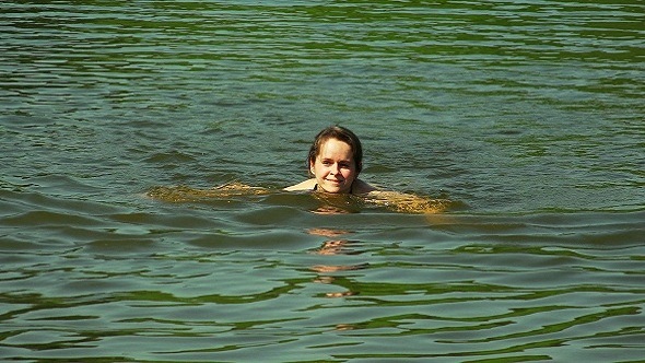 Beautiful Girl Bathing in the Lake