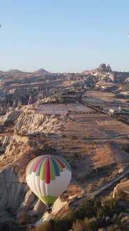 Vertical Video of Hot Air Balloons Flying in the Sky Over Cappadocia Turkey alt