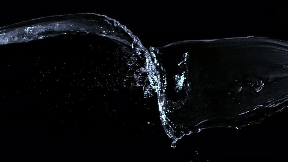 Super Slow Motion Shot of Water Splash at 1000Fps Isolated on Black Background. alt