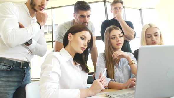 Young Students Process Information Received Through the Network on a Laptop Testing the Acquired alt