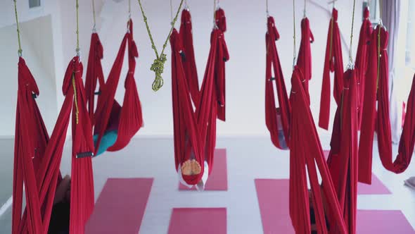 Fly Yoga Class with Ladies Recovering Energy in Hammocks alt