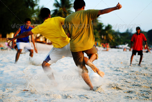 Playing Soccer on the Tropical Beach - Stock Photo - Images