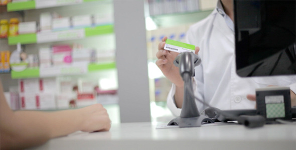 Pharmacist Serves Customer
