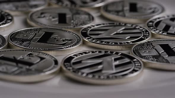 Rotating shot of Litecoin Bitcoins (digital cryptocurrency) - BITCOIN LITECOIN 0140 alt