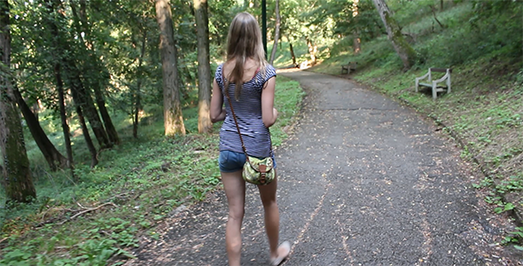 Girl Walking Alone Through the Forest 2