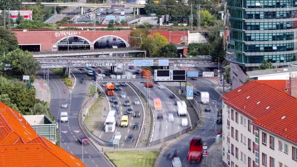 Day Time lapse of fast moving highway traffic showing cars and trains, Berlin, Germany