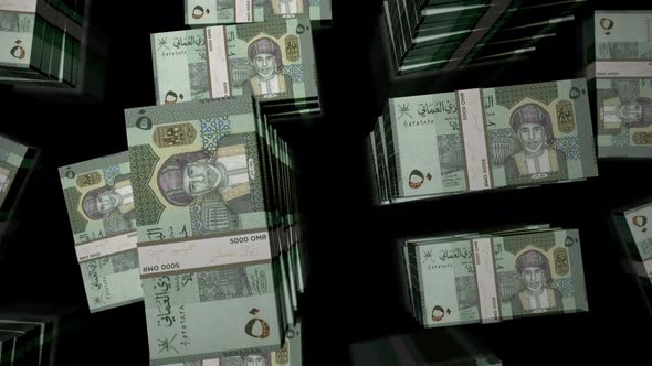 Flight over the Oman Rial money banknote packs loop alt