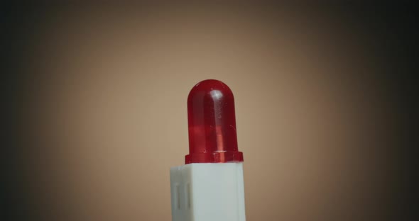Close up of a Red Light LED and Macro Shot of Electronic Components on Turn Table alt