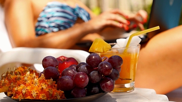 Woman in Bikini Working on Laptop alt
