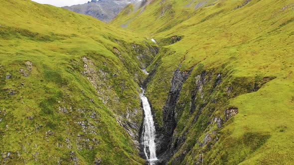 Aerial view of a waterfall in Anderson Bay, Unalaska, Alaska, United States. alt