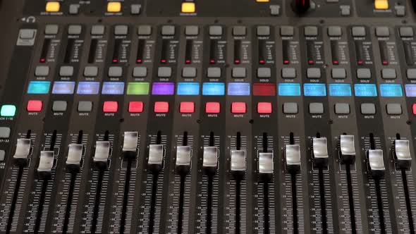 Remote control for adjusting the sound. Audio mixer. Sound engineer adjusts the sound.  alt