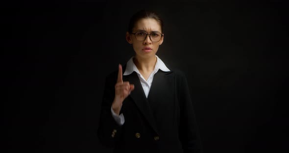 Business Woman with Glasses Threatened the Camera with Finger