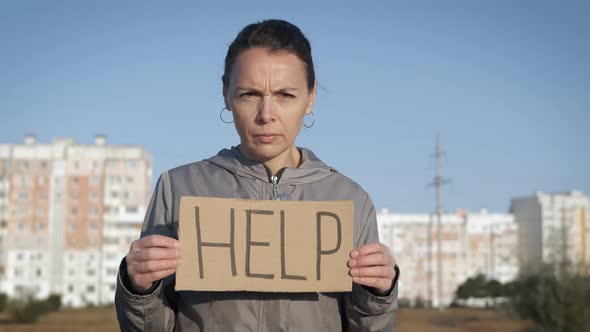 Woman with a Poster Help alt